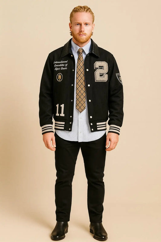 Front view of Patty Mills NYC 2025 black wool varsity jacket with patches