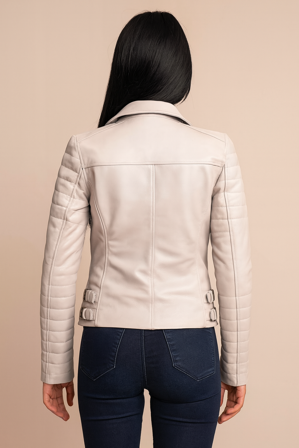 Back view of white leather jacket with quilted sleeves