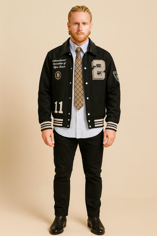Front view of Patty Mills NYC 2025 black wool varsity jacket with patches